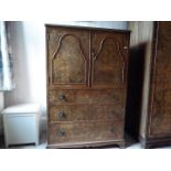 A walnut veneered cupboard over three drawers, originally purchased from Harrods,