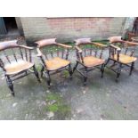 Four oak captains chairs.