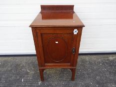 A mahogany bedside cabinet,