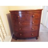 A substantial bow fronted chest of two over three drawers, raised on four turned supports,