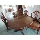 A good quality three section dining table, each section on castored supports,