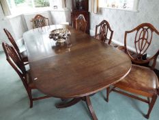 A good quality three section dining table, each section on castored supports,