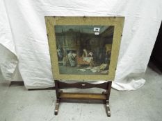 A small fold top table / fire screen having print to the top.