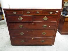 A substantial mahogany chest of three over two over three drawers, carved detailing,