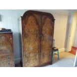 A good quality walnut veneered twin door wardrobe,