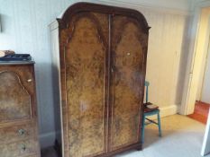 A good quality walnut veneered twin door wardrobe,