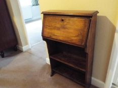 A small oak bureau bookcase, approximately 98 cm x 61 cm x 24 cm.