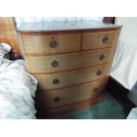 A bow front chest of two over three drawers measuring approximately 97 cm x 95 cm x 59 cm.