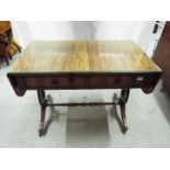 A good quality side table with drop leaf ends, twin drawers and protective glass top,