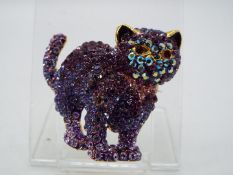 Butler & Wilson - a Butler & Wilson stone set brooch in the form of a cat,