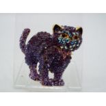 Butler & Wilson - a Butler & Wilson stone set brooch in the form of a cat,