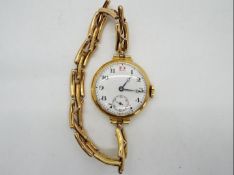 A lady's 15ct gold cased wristwatch on expanding bracelet stamped 15c,