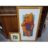 Two framed Disney Winnie The Pooh prints, largest approximately 98 cm x 53 cm.
