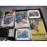 A small collection of military related posters and similar, including a Waffen SS,