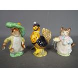 Three Beatrix Potter figurines comprising a Beswick Sally Henny Penny,