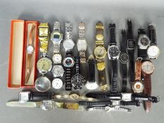 A quantity of modern wristwatches and similar, lady's and gentleman's.