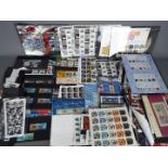 Philately - A large collection of mint stamps, first day covers, presentation packs,