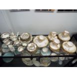 A collection of tea wares including Coalport 'Indian Tree' pattern and similar.