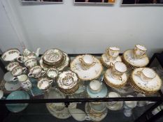 A collection of tea wares including Coalport 'Indian Tree' pattern and similar.