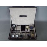 A Mele & Co watch box for storing 10 watches, containing eight fashion watches.