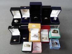 A collection of costume jewellery dress rings, all boxed.