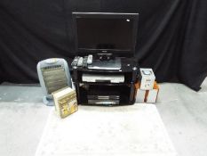 Lot to include a Toshiba 26" LCD television, Panasonic DVD player, Humax Freeview + box, TV stand,