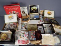 Philately - A collection of UK and foreign stamps, both loose and contained in albums.