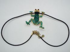 Butler & Wilson - a Butler & Wilson necklace with pendant in the form of a stone set frog with