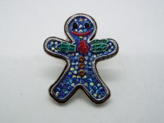Butler & Wilson - a Butler & Wilson stone set pin in the form of a gingerbread man,