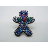 Butler & Wilson - a Butler & Wilson stone set pin in the form of a gingerbread man,