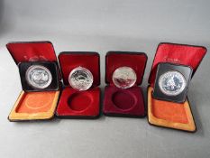 Four silver 1 dollar Canada coins comprising 1974, 1975, 1979 and 1983, all cased.