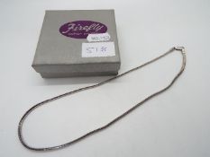 A silver necklace,