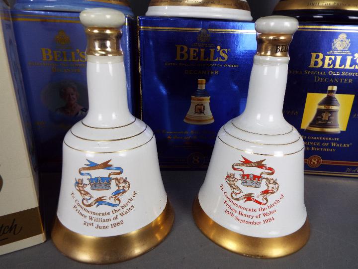 Six commemorative Bells ceramic whisky decanters (with contents) comprising four 70cl and two 50cl, - Image 2 of 4