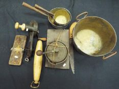 A quantity of vintage kitchenalia to include marmalade cutter, knife cleaner, pans and similar.