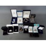 A collection of costume jewellery, dress rings and necklaces, all boxed.
