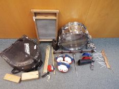 A Pearl Professional snare drum and percussion accessories.