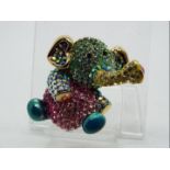 Butler & Wilson - a Butler & Wilson multicoloured stone set brooch in the form of an elephant,