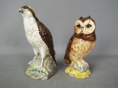 Two ceramic whisky decanters (with contents) modelled as birds of prey comprising a Royal Doulton