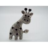 Butler & Wilson - a Butler & Wilson stone set brooch in the form of a giraffe,