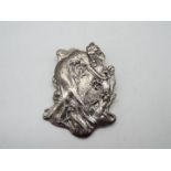 A white metal art nouveau style brooch in the form of a lady