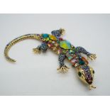 Butler & Wilson - a large Butler & Wilson multicoloured stone set brooch in the form of a lizard,