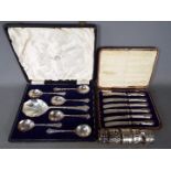 A cased set of George V silver handled butter knives, Sheffield assay 1911,