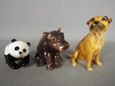 Beswick - Three Beswick animal figurines comprising Panda Cub, Hippo Calf and a Border Terrier,