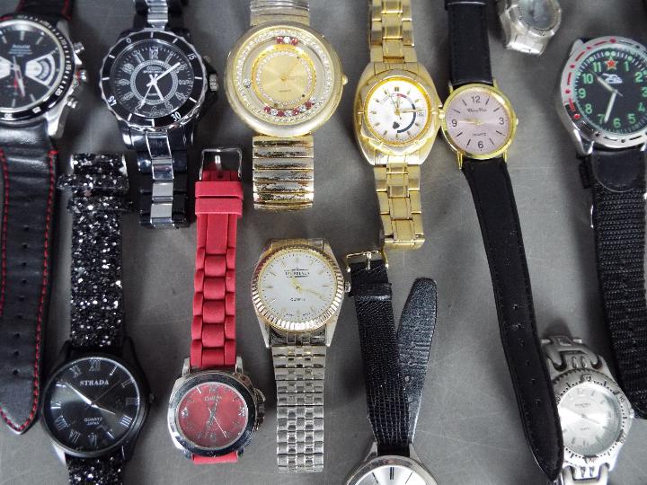 A collection of modern wristwatches and similar, lady's and gentleman's. - Image 4 of 4