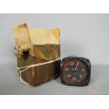 A vintage air speed indicator gauge with box marked 'Lancaster X Spares'