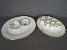 Two Cauldon China serving plates bearing Budge family crest and a set of six Royal Worcester coffee