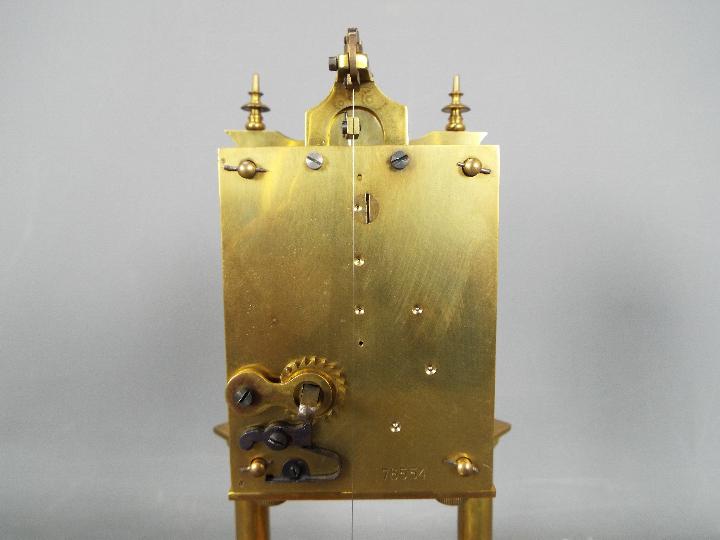 A brass torsion clock with disc pendulum, under glass dome, approximately 31 cm (h). - Image 5 of 6