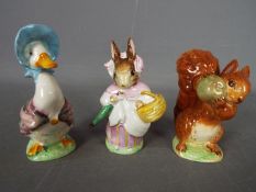 Beswick - Three Beatrix Potter figurines comprising Mrs Rabbit,
