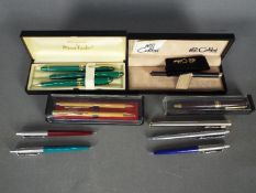 A collection of pens to include Parker, PaperMate and similar.