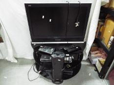 A television stand with 26" Panasonic LCD television, Panasonic DVD player and similar.